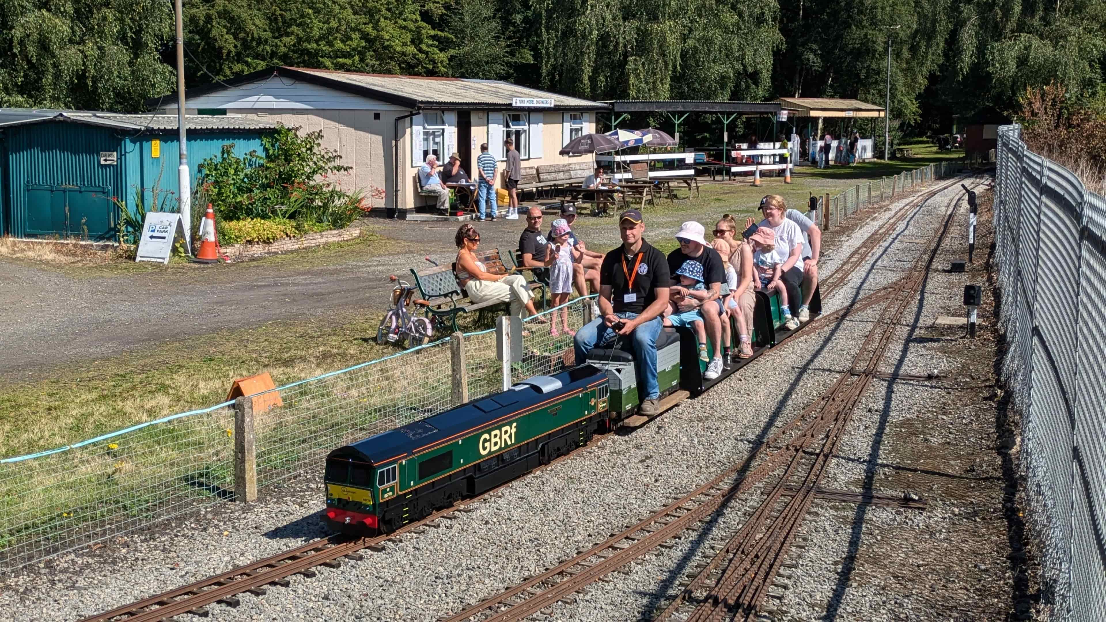 Visitors riding miniature trains during a public open day at York Model Engineers